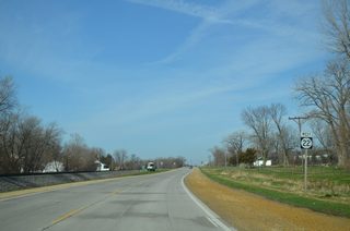 Iowa 22 (Front Street) leaves the Buffalo street grid beyond Elm Street. Speed limits resume at 55 miles per hour as the route parallels a Dakota, Minnesota & Eastern (DME) Railroad Corporation line.