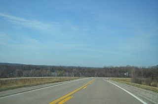 A sweeping S-curve takes Iowa 22 northward around Midway Beach and across a DME Railroad spur. The realignment was built in 1996.