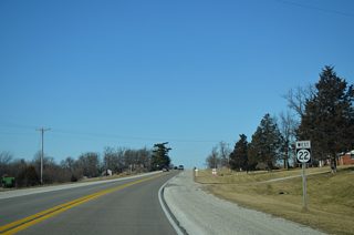 Iowa 22 veers northwest and merges with Lucas Road ahead of this reassurance marker.