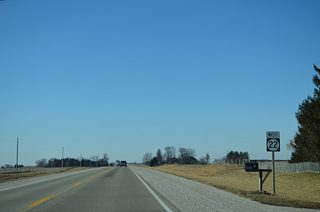 Iowa 22 turns west again for 2.85 miles from ahead of Seven Springs Road and this shield assembly.