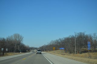 Muscatine County Road X43 (Independence Avenue) winds southwest from Iowa 22 to eventually reach the city of Letts.