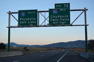 I-15 continues south across Chubbuck Road into the directional T interchange (Exit 72) with Interstate 86 west.