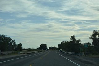 U.S. 20 west crosses the Fall River just ahead of milepost 354.