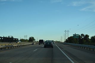 Crossing the Snake River ahead of milepost 326, U.S. 20 westbound enters Jefferson County.