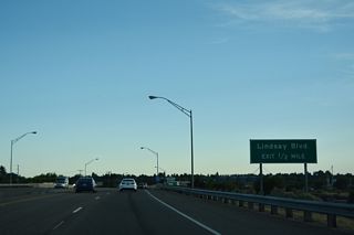 U.S. 20 spans the Snake River west ahead of the folded diamond interchange (Exit 307) with Lindsay Boulevard.