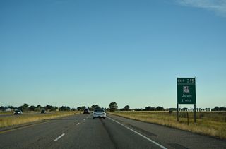 U.S. 20 enters the city of Ucon at the diamond interchange (Exit 315) with ID 43 south and 105th N.