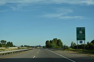 ID 33 resumes west from U.S. 20 and Rexburg at Exit 333. ID 33 west to ID 28 north leads to U.S. 93 in the Lemhi County seat of Salmon. Construction in 2024 converted the exchange at Exit 333 into a DDI.