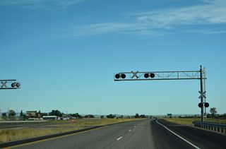 Construction of the diamond interchange with 400 N and Yellowstone Highway (Old U.S. 20) included the removal of an at-grade Union Pacific Railroad crossing. First planned in the early 1980s, the exchange was built during work from Fall 2023 to Fall 2025 (ITD, 2026).