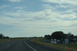 U.S. 20 continues west to St. Anthony along a freeway paralleling Henrys Fork River.