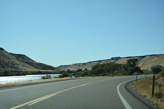 SH 78 straddles the north side of the Snake River before turning south across the waterway.