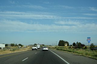 Construction from April 2023 through 2026 adds a lane in each direction of Interstate 84 between Exit 168 and the Twin Falls Interchange (Exit 173).
