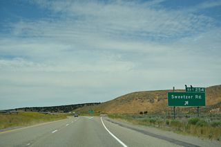 Meadow Creek Road ties into the Sweetzer Road (3600 E) on the east side of the exchange at Exit 254.