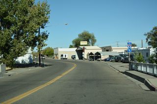 An I-84 trailblazer stands along 1st Avenue by the crossing of Little Canyon Creek.