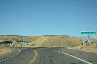 Construction eventually removed the curve along Business Loop I-84 and realigned Old Highway 30 as a continuous roadway with Cold Springs Road intersecting from the north.