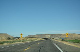 Leading away from unincorporated Hammett, Old U.S. 30 shifts north across a Union Pacific Railroad line.