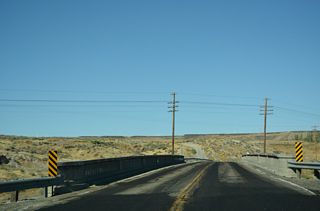 The vintage bridge across the Union Pacific Railroad included a weight restriction prior to its replacement. Following completion of the new bridge, Business Loop I-84 to Hammett was decommissioned.