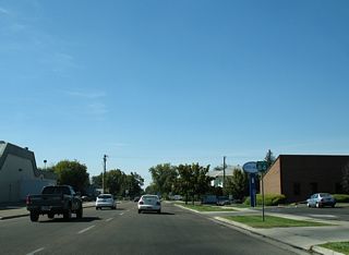 A reassurance shield for Business Loop I-84 stands along Blaine Street by Caldwell City Hall, west after 5th Avenue.