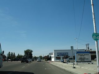 A reassurance marker for Business Loop I-84 was posted beyond Kimball Avenue along Blaine Street west. This shield was removed during a street-scaping project along Blaine Street. That coincided with work for a linear park along adjacent Indian Creek.