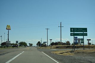 Business Loop I-84 to Mountain Home commences west along American Legion Boulevard from the diamond interchange joining U.S. 20 with I-84/U.S. 26-30.