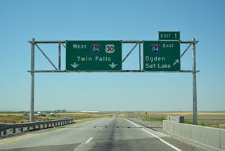 Construction underway from Mqy 2018 to Winter 2020 rebuilt the trumpet interchange (Exit 1) joining I-84/86. The redesign improved the geometry of the I-84 westbound roadway and shifted the merge of I-86 west to the outside lanes. U.S. 30 follows I-84 west to ID 24 at Exit 211, where the US highway angles south into Heyburn and Burley.