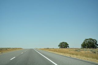 Two trees are all that remains of previous rest areas that once lined both sides the freeway four miles east of Interstate 84. All other physical traces have long since been removed.