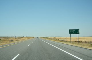A distance sign remains in place beyond the former rest area along I-86 west. Burley is 17 miles to the west along Business Loop I-84. Twin Falls is 52 miles away via U.S. 30 beyond the separation with I-84.