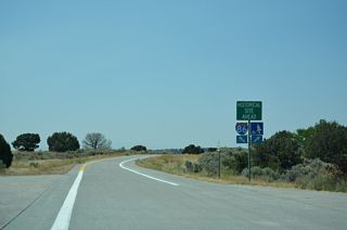 Beyond the rest area, I-86/U.S. 30 west pass to the south of Massacre Rocks State Park. Massacre Rocks was given its name by emigrants who engaged in wagon party skirmishes with native Indians near a narrow passage of rocks where the Oregon Trail traversed.3 Exit 28 provides the only access to the park in one mile.