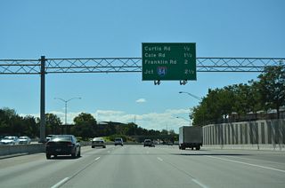 A diamond interchange joins I-184 with Curtis Road at Exit 2. I-184 curves southwest 2.5 miles to Interstate 84.