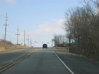 U.S. 20 approaches the intersection with County Road 200 West/Fox Lake Road. Buck Lake can be accessed via County Road 200 West and Buck Lake Road to the north.