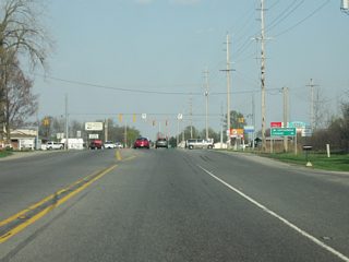 U.S. 20 at the intersection with SR 5. SR 5 is a 96 mile highway that starts in Upland in Grant County and heads north through Huntington, South Whitney and Ligonier before reaching U.S. 20. North of here, it enters the town of Shipshewana (population 628). Shipshewana is the most famous of the Amish communities in LaGrange County and is known as a tourist attraction for its Amish attractions, most famous among them being their flea markets and auctions. North of Shipshewana, SR 5 ends at SR 120.