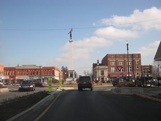 Now at the traffic circle with U.S. 20 (Maumee Street) and SR 127 north (Wayne Street.) The area around the traffic circle, plus the four spokes that radiate from it (along Maumee and Wayne Streets), were rebuilt in 2011 as part of a project to make travel along the roads safer for both motorists and pedestrians.