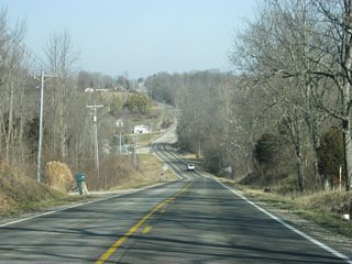 SR 101 passes over some hilly terrain to the north of Contreras Pike.