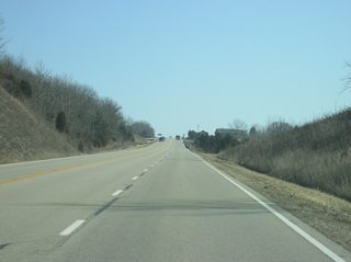 A view of SR 101 as it continues to climb up the hill that abuts Brookville Reservoir to the southeast. A climbing lane is necessary so that traffic can pass the vehicles carrying boats that frequent the highway.