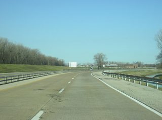 Heading northwest from Interstate 164 along Veterans Memorial Parkway, there are no exits between U.S. 41 and Shawnee Drive. The parkway runs for four miles as an unofficial extension of Interstate 164, though commercial trucks are prohibited from using the route. The controlled-access route bypasses the residential neighborhoods of Evansville's south side to provide a direct link into Downtown Evansville.