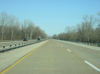Heading northwest from Interstate 164 along Veterans Memorial Parkway, there are no exits between U.S. 41 and Shawnee Drive. The parkway runs for four miles as an unofficial extension of Interstate 164, though commercial trucks are prohibited from using the route. The controlled-access route bypasses the residential neighborhoods of Evansville's south side to provide a direct link into Downtown Evansville.