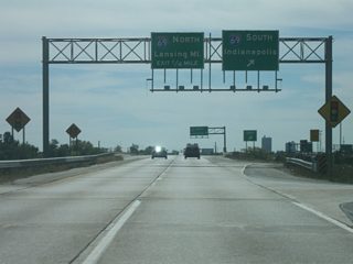 Looking south at the interchange with Interstate 69. Lansing, Michigan is the northbound control city of the interstate via Auburn, Angola and Coldwater, Michigan. Interstate 69 heads south toward Marion, Muncie, Anderson and Indianapolis and will eventually head further southwest toward Evansville. Coldwater Road follows the former routing of U.S. 27 and SR 327 from Interstate 69 south toward Clinton Street, which leads to present-day U.S. 27 en route to Downtown Fort Wayne.