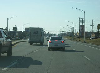 A view of Illinois Road on the north side of the Jefferson Pointe shopping center. A southern branch of Illinois Road comes in from the southeast to meet up with the highway in earnest.