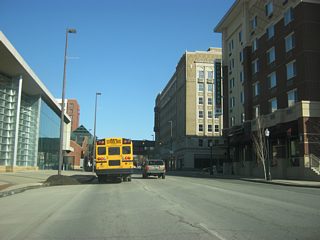 Passing by a new downtown hotel, which is across the street from the Grand Wayne Convention Center, along Jefferson Boulevard. The stoplight ahead is with Harrison Street.