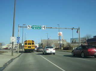 East of Barr Street, Jefferson Boulevard nears the intersection with Lafayette Street (U.S. 27 north). The one way couplet of Clinton and Lafayette Streets (with Barr Street in the middle) used to carry U.S. 33 along with SR 1 and SR 3. Today, it just carries U.S. 27. An Interstate 69 shield directs traffic to the north along U.S. 27 toward the interstate.