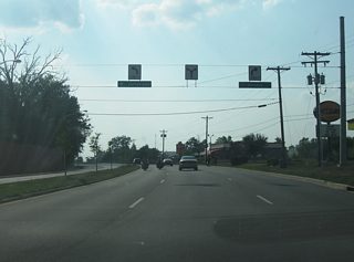 Jefferson Boulevard nears the split with Illinois Road, which continues in a due west direction toward Interstate 69 along the former routing of SR 14. Jefferson Boulevard continues toward the southwest along the former routing of U.S. 24.
