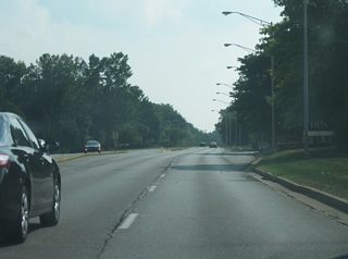 Views of Jefferson Boulevard to the west of Apple Glen Boulevard as they near the intersection with Covington Road in the second picture. The highway remains four lanes to the southwest as it follows the original routing of U.S. 24.
