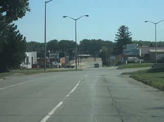 Maumee Avenue ends as the three travel lanes of the old routing of U.S. 24, U.S. 30 and SR 14 come together with the westbound lanes, at which point the road carries the name of Washington Boulevard (which carries the westbound lanes as part of the one way couplet with Jefferson Boulevard/Maumee Avenue).
