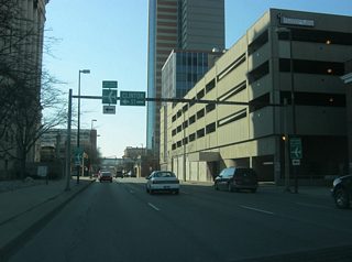 Now coming up on the intersection with Clinton Street (U.S. 27 south). Clinton Street carries the routing of U.S. 27 to the south toward the Fort Wayne International Airport and Decatur.