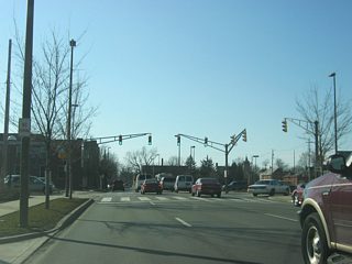 Washington Boulevard now approaches the intersection with Ewing Street as it passes by the Allen County Public Library. Ewing Street at one time carried the routes for U.S. 30 and U.S. 33 to the north toward Goshen Road, where the highways continued to the northwest to their split northwest of Fort Wayne.