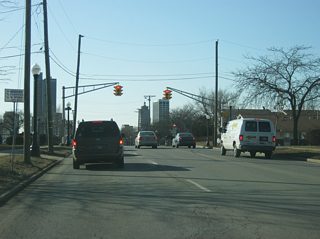 West of Anthony Boulevard, Washington Boulevard follows the old routing of U.S. 24, U.S. 30 and SR 14 west toward Downtown Fort Wayne. The road typically consists of three westbound lanes at it passes by the campus of Indiana Tech in the first picture, the intersection with Harmar Street in the second picture and Hanna Street in the fourth picture.