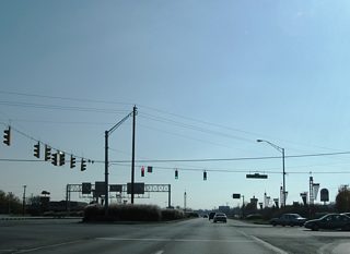 Without a direct connection until 2012, when a new interchange between U.S. 136 and Interstate 465 opened, the freeway stub east from Interstate 74 to Crawfordsville Road was the method by which U.S. 136 connected with the Beltway. The US highway was truncated slightly west to the new Exit 16A of the beltway.