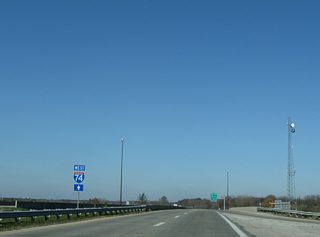 An Interstate 74 trailblazer commenced the route along the Crawfordsville Road freeway stub above Interstate 465. Interstate 74 ITS markers were used on the stub freeway as well.