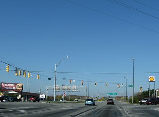 A signalized intersection connected the east end of U.S. 136 with the freeway stub west to the beltway in lieu of direct ramps. High School Road tied in from the north. U.S. 136 stretches across five states for 804 miles between Indianapolis and Edison, Nebraska.