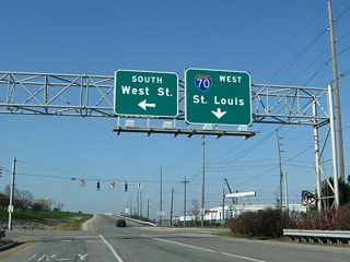 The westbound on-ramp forms a brief frontage street connecting Missouri (north) and West (south) Streets within Exit 79A. Interstate 70 spans the White River to West Indianapolis and continues to Indianapolis International Airport (IND), Terre Haute and St. Louis.