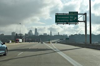 Exit 1B lowers from the Dillingham Freeway viaduct to form an eastbound service road for the one way couplet of Genessee Street south and Wyoming Street north.